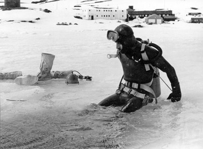 Dave Marsh at ice hole in front of Base winter 1975