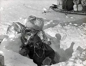 Emerging from ice cave dug for supplies