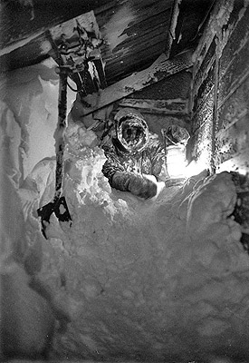 Return Night watchman Hodgeman pushing way through snow into Hut after visit Met screen