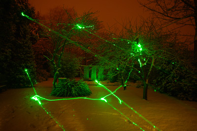 Snow at night lit by laser pen