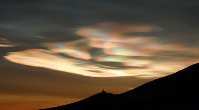 Nacreous clouds are lit up by the sunrise at McMurdo, Antarctica