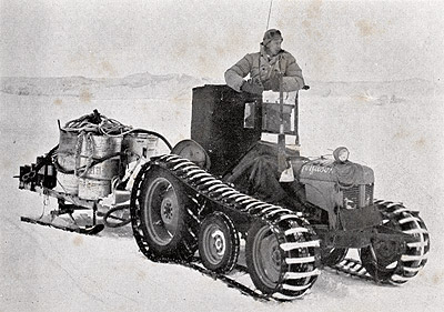 tractor towing a load of tractor fuel at Scott Base during the Commonwealth Trans-Antarctic Expedition 1957
