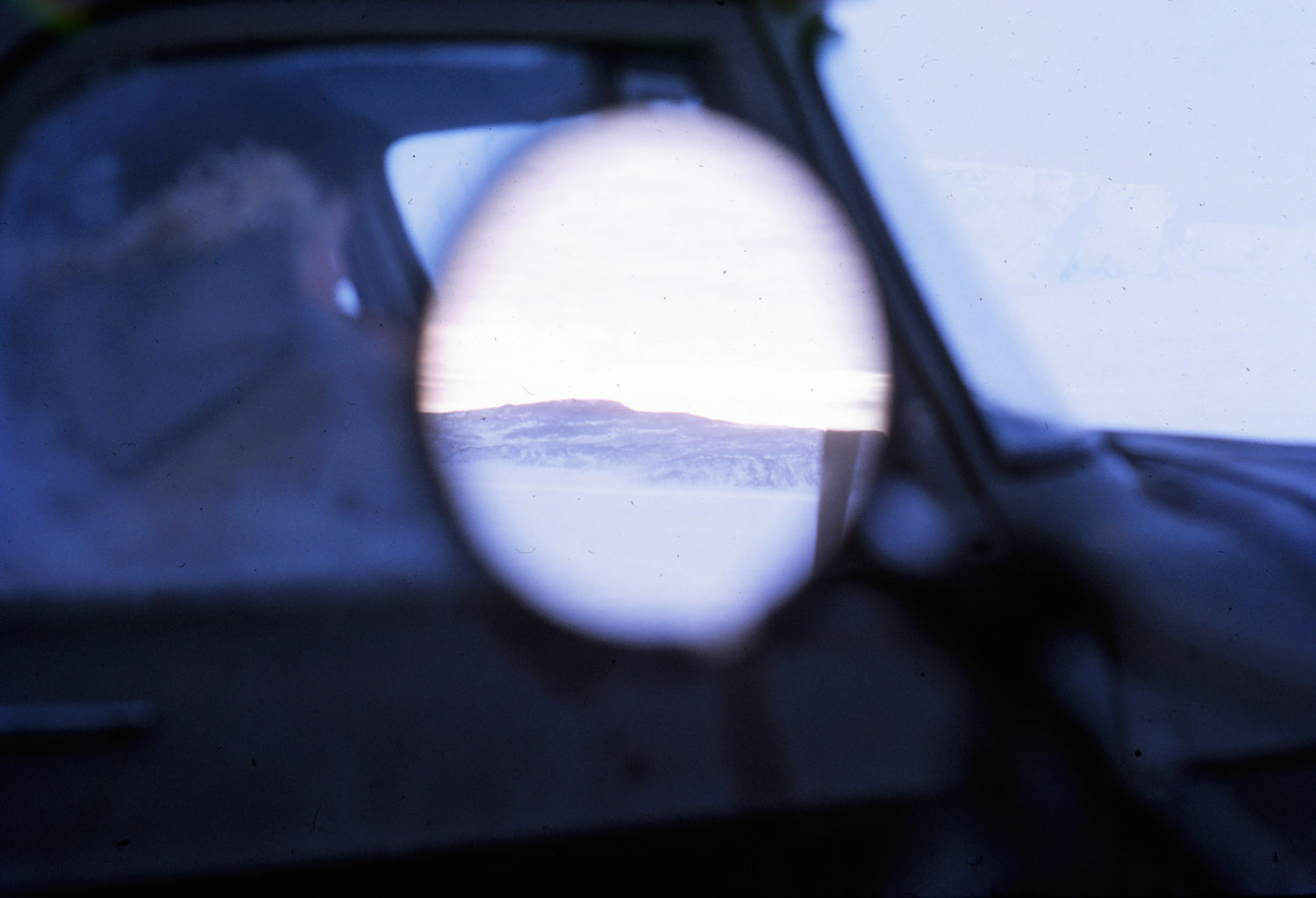 Landscape in a Vehicle Mirror