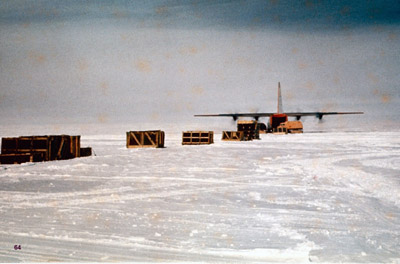 A C-130 dropping off supplies