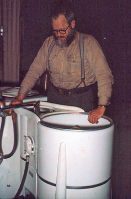 Ben Harlan, scientific leader of the station, doing his laundry