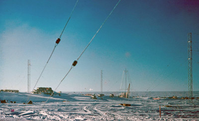 View from the air strip past antennas and fuel drums